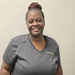 merry maid wearing a grey uniform